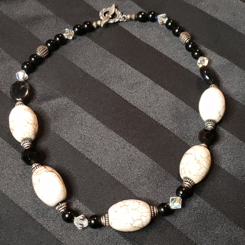 Handmade white and black beaded necklace.